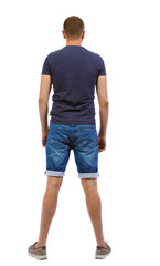 Back view of handsome man in shorts.