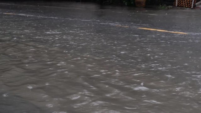 Flooded road in Bangkok after raining.