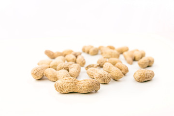 Pile Of Peanuts On White Background Closeup