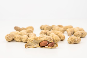 Pile Of Peanuts On White Background Closeup