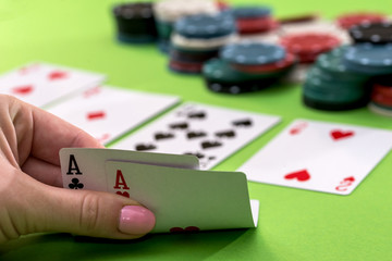 two aces in the hands of a close-up