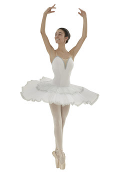 ballerina doing the releve pose with white tutu on white background