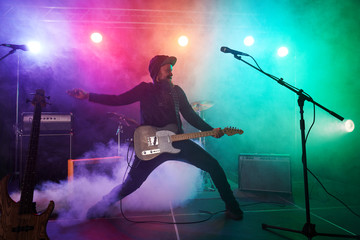 Obraz premium The guitarist performs on stage.