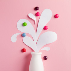 Yogurt bottle with splashes and vitamins