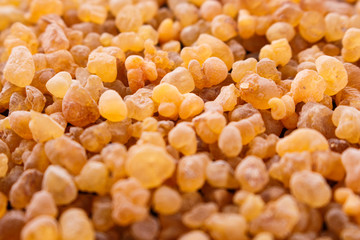 frankincense essential oil on a wooden background