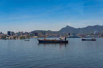 Fototapeta na wymiar View of Rio de Janeiro City Skyline and Mountains from the Guanabara Bay, with Industrial and Commercial Ships