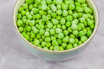 Frozen peas in a bowl, top view