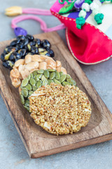Korean traditional sweet snacks on a wooden plate, vertical