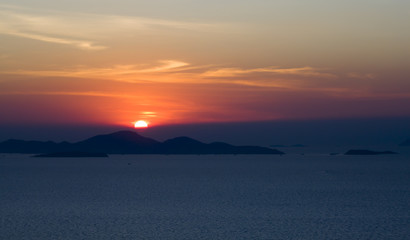 Naklejka na ściany i meble Sunset over the ocean. The Gulf of Thailand. Thailand. Pattaya. Pacific Ocean.