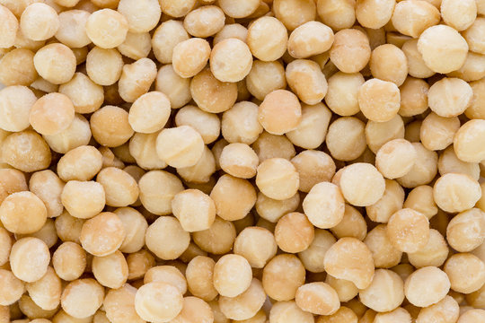 Background texture of fresh natural macadamia nuts