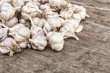 Garlic bulbs. Fresh garlic with  on wood board.