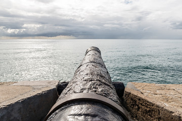 cannon pointing to the sea