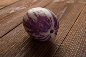 fresh pepino fruit on wood background close up
