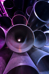 Big piles of metal pipes. Industrial robust pipes