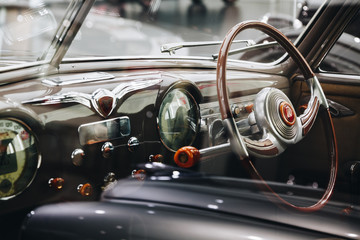 Interior vintage car with steering wheel and dashboard