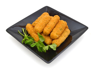 fried cheese sticks in blck plate on white