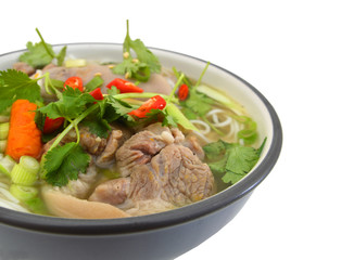 A noodle soup bowl: pork, pepper and onion