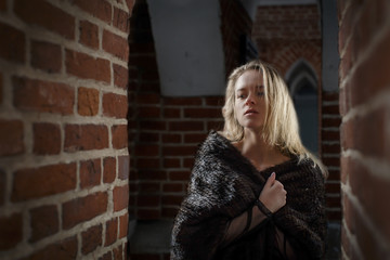 Fototapeta premium young beautiful girl outdoors in winter in a fur coat