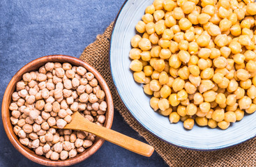 Chickpea dry and fresh cooked in bowls top view.