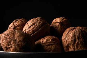 Walnuts on black background