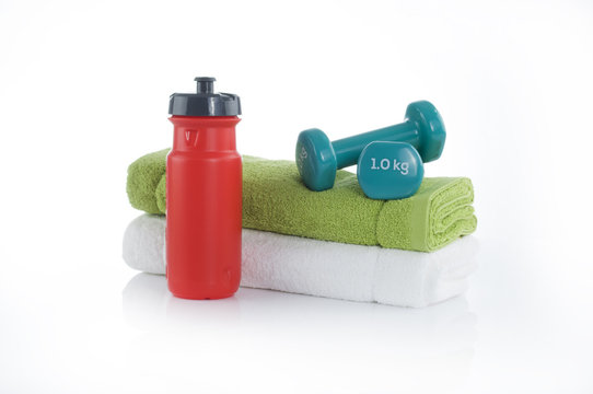 bicycle bottle with dumbbells and towels. Summer sport