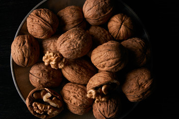 Walnuts on black background