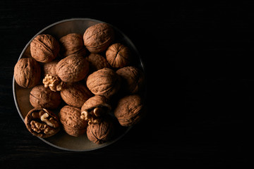 Walnuts on black background