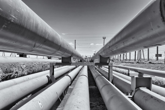 detail of steel light pipeline in oil refinery. Black and white photo