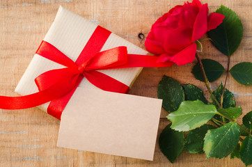Present or gift box, rose and empty greeting card.