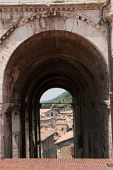 Fototapeta na wymiar Gubbio, medieval under passage with view.