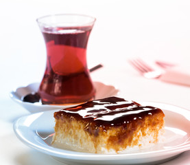 Cherry trilece dessert on white background. Dessert concept with Turkish tea.