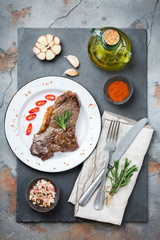 Grilled beef steak with spices ready for dinner