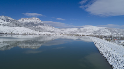 irrigation dam and magnificent snowy mountains