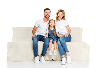 happy european family sitting on sofa, isolated on white