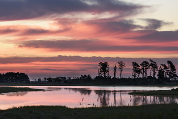 Obraz premium Dramatic and Colorful Sky with Reflections in Water