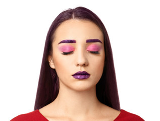 Fototapeta premium Young woman with dyed eyebrows and creative makeup on white background