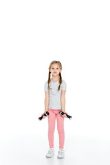 kid in sportswear exercising with dumbbells isolated on white
