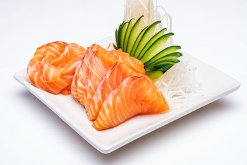 Sashimi, Salmon, Japanese food chopsticks and wasabi on the wood table

