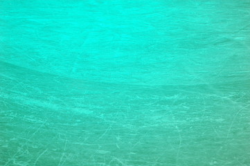 A section of ice on the rink, covered with multiple scratches.
