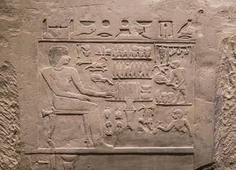 ancient stone relief at Chnum temple in Egypt
