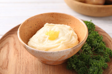 Bowl with mashed potatoes on table