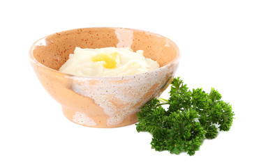 Bowl with mashed potatoes on white background