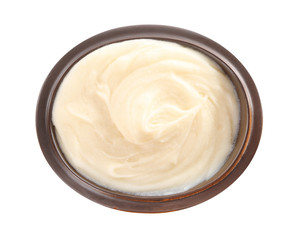 Bowl with mashed potatoes on white background