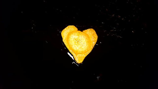 Fry carrots in the shape of heart in a frying pan