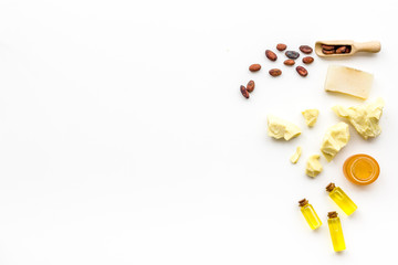 Cocoa butter for skin care. White background top view copy space