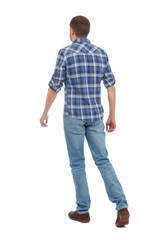 Back view of going  handsome man. walking young guy .
