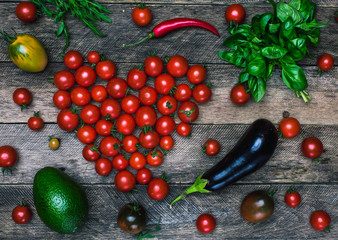 Tomato heart shape and vegetables as healthy eating concept