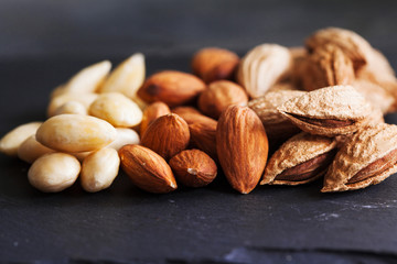 Three kind of almond: in shell, natural and peeled nut. Healthy food concept top view