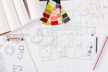 Architectural project, engineering tools on table.