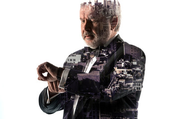 Fototapeta premium Portrait of bearded businessman. Double exposure city on the background.